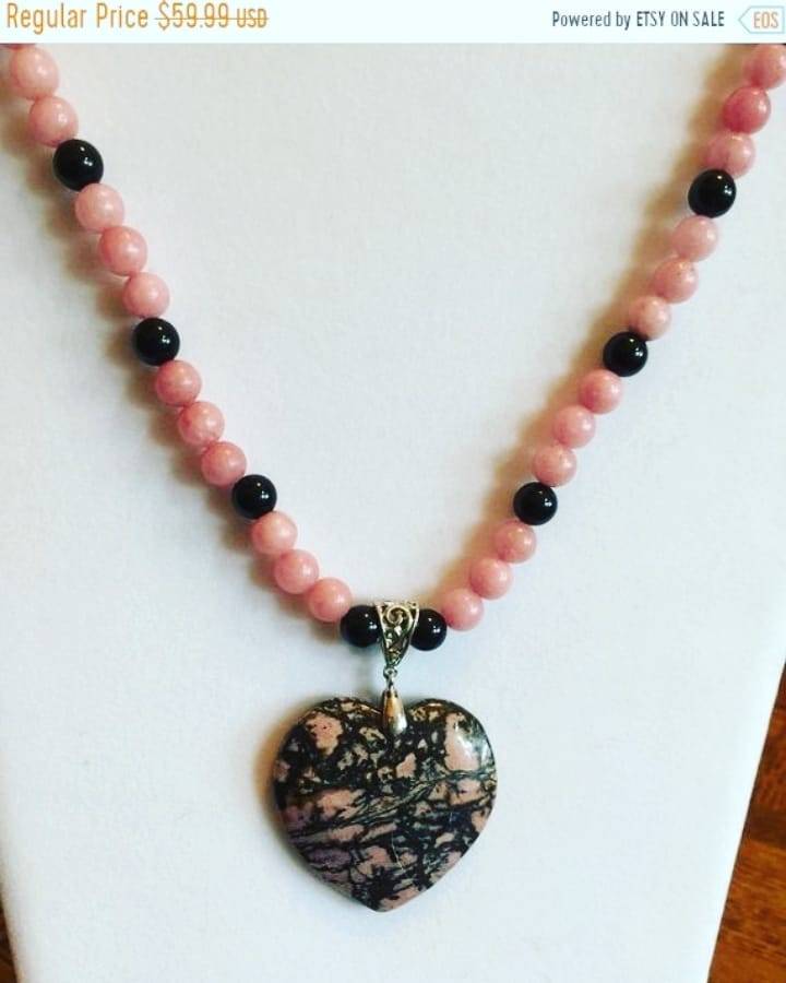 <p>#Etsyshop @Jazzygems56 Semi-Precious Morganite & Onyx Semu Precious Necklace 19" Long with a Rhodnite Heart pendant Etsy Free Shipping<br/>
💗💗💗💗💗💗💗💗💗💗💗💗💗💗💗</p>
<p>Morganite is a mineral that activates cleansing and stimulating the heart chakra. It brings love into one’s life and assists one in maintaining that love to grow. It stimulates creativity in issues of self-control, assisting one to act from love and bring wisdom to the calmness of one’s mind. It brings forth patience and reverence for one’s life.<br/>
💗💗💗💗💗💗💗💗💗💗💗💗💗💗💗<br/>
Onyx initiates modes of centering and alignment of the total person with higher powers. It can banish grief, to enhance self control, stimulate wise decision making, and to encourage happiness and good fortune.It helps one become the master on ones own good future.<br/>
💗💗💗💗💗💗💗💗💗💗💗💗💗💗💗<br/>
Rhodonite is known as “The Stone of Love” and helps one to achieve their greatest potential. It is also excellent for stimulation, clearing, and activation of the heart chakra, while providing for grounding of the physical and mental energies at the same time. It can assist one in attaining ones “greatest potential”, dispelling anxiety and promoting coherence during chaotic encounters.<br/>
💗💗💗💗💗💗💗💗💗💗💗💗💗💗💗</p>
<p>#freeshipping #rhodonite #gemstonehearts #fortmyers #onyx #northfortmeyers #fortmeyersflorida #giftsforgrandma #giftsforteachers #giftsfornurses #ooakjewelry #handmaderevelotion #rockhound #bohojewelry #ecogifts #macrame #healingjewelry #heartchakra #chakra #anxiety #morganite #pinkandblack #onyxandpink #pinkpendant #pinkgemstone #giftsunder50 </p>
<p><br/>
(at North Raleigh)<br/>
<a href="https://www.instagram.com/p/BqNaeZclKol/?utm_source=ig_tumblr_share&igshid=1izw1aevv6i8e" target="_blank">https://www.instagram.com/p/BqNaeZclKol/?utm_source=ig_tumblr_share&igshid=1izw1aevv6i8e</a></p>