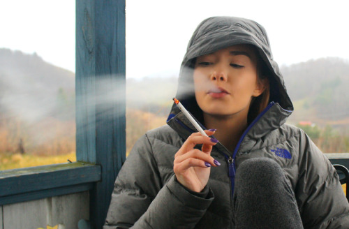 Lacey Chabert smoking a cigarette (or weed)
