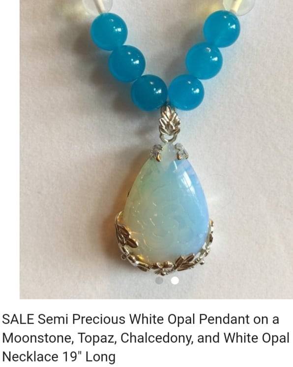 <p>#shopSmall #SmallBizSat @JazzyGems56 <br/>
Semi Precious White Opal Pendant on a Moonstone, Topaz, Chalcedony, and White Opal Necklace 19" Long</p>
<p>White OpalPendant 1 ½"L ong Teardrop shape with silver colored filagree, on 8mm Moonstone beads, 10mm Topaz beads, 8mm Chalcedony beads, 4mm Aquamarine, and 8mm White Opal Semi-Precious Necklace 19" Long.</p>
<p>Chalcedony is useful for balancing the mind, body and spirit. A sacred stone of the native Indians,, used for ceremonial activities for receiving transmissions of thought from one to another. It symbolizes benevolence and goodwill, from the nurturing energy of the stone. It enhances generosity, responsiveness and receptivity.</p>
<p>White Opal helps one recognize their creativity, providing inspiration and imagination to all situations. It furthers spontaneous action, enhancing the release of inhibitions. It can strengthen memory and instill faithfulness and loyalty with respect to love, personal affiliations and business relationships. </p>
<p>Moonstone is a stone for feeling and understanding emotional thoughts. It stimulates intuitive recognition. It stimulates confidence and composure as well. Also called “The Traveler’s Stone”, keeping one protected against the perils of travel. </p>
<p>Topaz is “The Stone of True Love” and “Sucess in All Endeavors”. It promotes individuality and creativity, while providing for confidence in trusting ones decisions. It acts to replace negativity with love and joyfulness.<br/>
.</p>
<p>.<br/>
#moonstone #moonstonejewelry #moonstonependant #etsyshop #handmadenecklace #topaz #bluetopaz #whiteopal #whiteopaljewelry #chalcedony #whiteopalpendant #topazpendant #100positivefeedback #positivefeedback #healingnecklace #healinggemstones #florida #shopsmallftmyers #shopsmallflorida #shopsmallmiami #pendantnecklace #promobykavalon #etsyonsale #freeshipping #aquamarine #aquamarinenecklace #turquoisenecklace (at Fort Myers, Florida)<br/>
<a href="https://www.instagram.com/p/BqkDo9glOOE/?utm_source=ig_tumblr_share&igshid=kba6lj5vpm9u" target="_blank">https://www.instagram.com/p/BqkDo9glOOE/?utm_source=ig_tumblr_share&igshid=kba6lj5vpm9u</a></p>