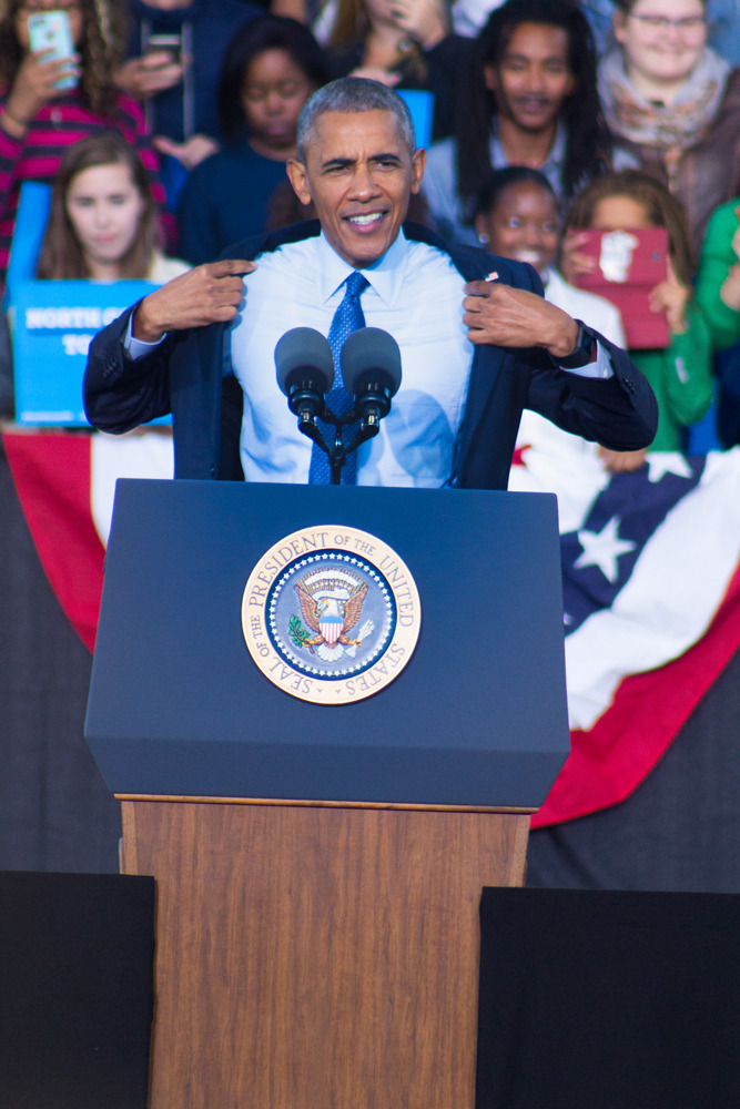 President Barack Obama takes jacket off as he speaks in Greensboro, North Carolina Campaigning for Hillary Clinton