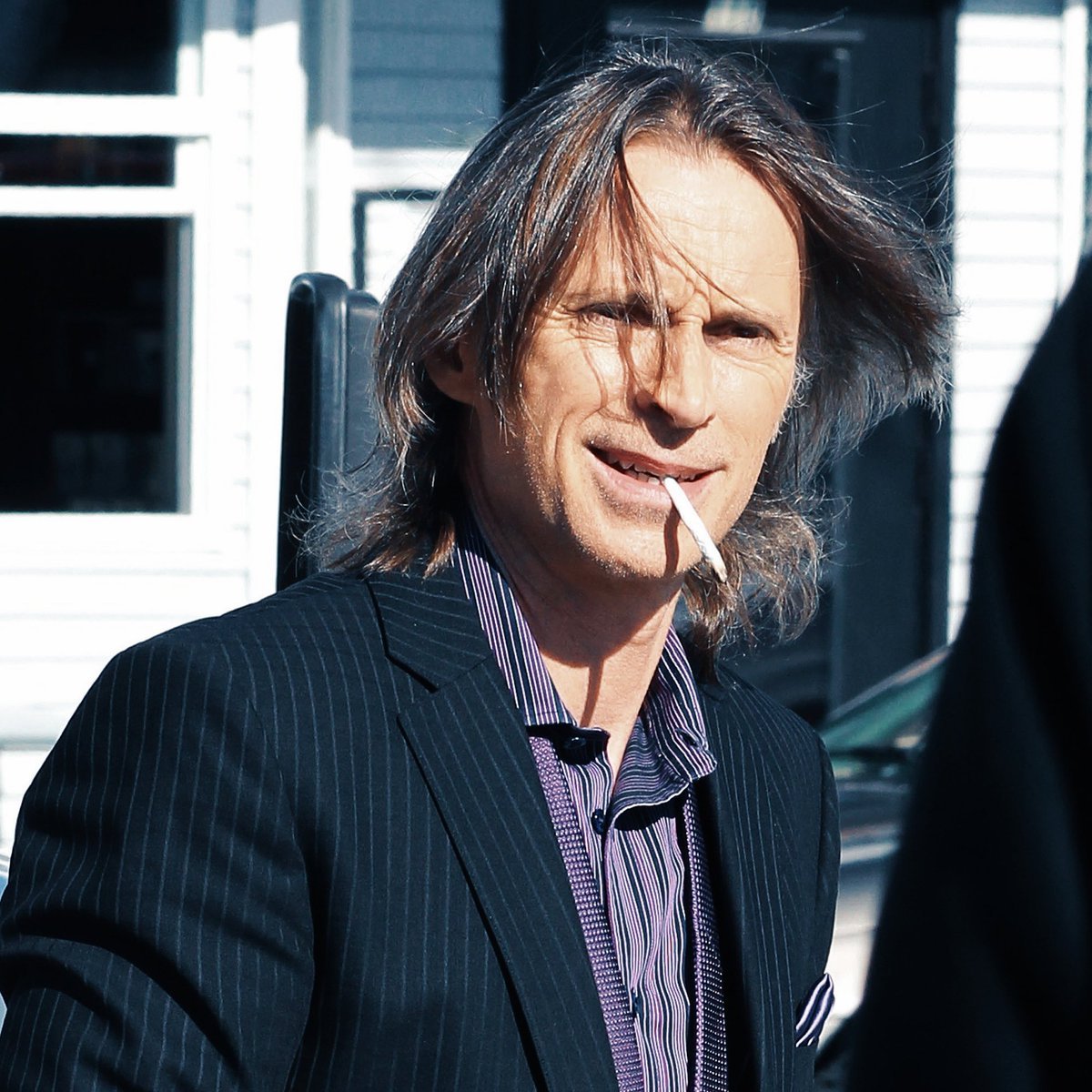 Robert Carlyle smoking a cigarette (or weed)
