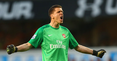 <h2>Arsene Wenger says Wojciech
Szczesny is still a great goalkeeper and has backed the Pole to prove
his class in Saturday’s FA Cup semi-final against Reading at Wembley.</h2><p>Szczesny has not
played since the FA Cup quarter-final win at Manchester United after
losing his place to David Ospina following some poor performances
and negative off-field headlines.</p><p>But Wenger believes the Polish goalkeeper is good enough to return between the posts against Reading on Saturday.</p><p>“I believe that before a game you prepare mentally and there is no special problem,” said Wenger.</p><p>“I
replaced Wojciech because he had a bad game. I still think he is a
great goalkeeper and I want him as well to have the opportunity to show
that.</p><p>"On Wednesday night, I watched PSG against Barcelona and
they (Barcelona) played their goalkeeper number two (Marc-Andre ter
Stegen) in the Champions League game. Why? Because you need to give them
as well competition.”</p><p>Wenger continued: “They know the rules. It is based on merit.</p><p>"If you have a disastrous game you don’t play in the next one, but as well the first priority is the quality of the competition.</p><p>"You are right (Ospina has done nothing wrong), but if Wojciech remained number one, Ospina would play on Saturday.</p><p>"Once
you have the rule, based on the fact Wojciech had a good game
against Manchester United and there is no special reason to drop him
(now) for Saturday.”</p><p>Asked if Szczesny had a long-term future at
Arsenal, Wenger replied: “I hope yes, but at the moment it is very
difficult to answer that question. What is important is Saturday.”</p><p>Szczesny’s attitude since being dropped has impressed Wenger.</p><p>“He has trained well, and is very focused,” the Gunners boss said.</p><p>“The
problem is to repeat the level of concentration. Wojciech has a
good potential of focus, but take any goalkeeper in any club, you don’t
have many who play every absolutely all the games in Europe. They need
their moments of (a) breather where they can recharge and focus again.”</p><p>Wenger, though, warned against anyone expecting the jersey was theirs to keep.</p><p>“At the moment it can change again on the performances of Ospina and the performances of Wojciech,” he said.</p><p>“We are in a competitive world and you have to accept that nothing is definite, every day it can change.”</p><p>The Arsenal boss added: “As I told you many times it is our job to fight for your places, no matter how difficult it is.</p><p>"I accept that it is difficult. But when you choose this kind of job, you know it is down to competition.”</p><p><a href="http://www.thegunners247.uk" target="_blank">The
Gunners</a> head into this weekend’s Wembley showdown firm favourites as
they aim to defend their FA Cup crown but Wenger insists there will no
air of complacency against the Sky Bet Championship side.</p><p>“It is
exactly the same (pressure as in 2014), maybe the environment is
less (pressure), but yourself you have exactly the same. You want to go
to the final and get there. You have to absolutely spot on with
everything,” he said.</p><p>“You can always imagine the consequences of not going (through).</p><p>"You
want to keep the positive vibes in the team and around the
club, therefore there is only one way, and I have enough experience to
know how big this game is.”</p>