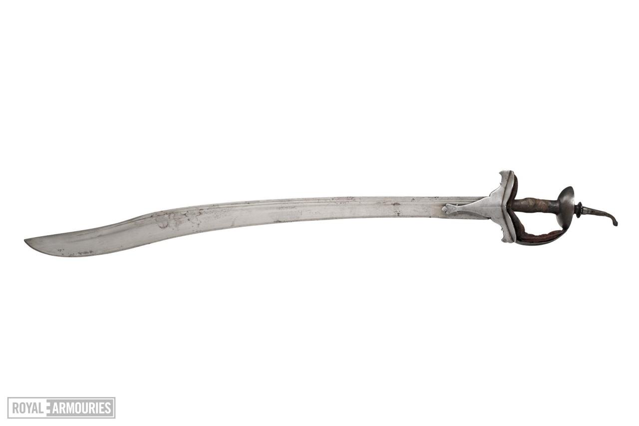 “Object Title
Sword (khanda)
Date
1771-1799
Object Number
XXVIS.118
Provenance
From the Indian disarmament in 1859. Presented by the Indian Government 1861 (Hewitt 1870).
Physical Description
The blade is curved and single edged with two narrow...