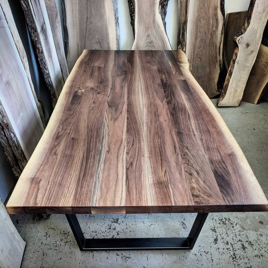 <p>Another stunner of a live edge black walnut dining table just about done at the Toronto shop. This one is finished with @osmocanada satin Polyx. It really brings out the colour and grain on the table. For legs we used gun metal grey steel trapezoids. Ready for its new home.</p>
<p>Contact your closest Barnboardstore location to have a custom table made for your specifications - we use Ontario hardwoods such as Ash, Walnut and Maple and our steel legs are locally produced also!</p>
<p> (at Barnboardstore.com)<br/>
<a href="https://www.instagram.com/p/BsdSSQOh-fo/?utm_source=ig_tumblr_share&igshid=1nbtscti203av">https://www.instagram.com/p/BsdSSQOh-fo/?utm_source=ig_tumblr_share&igshid=1nbtscti203av</a></p>