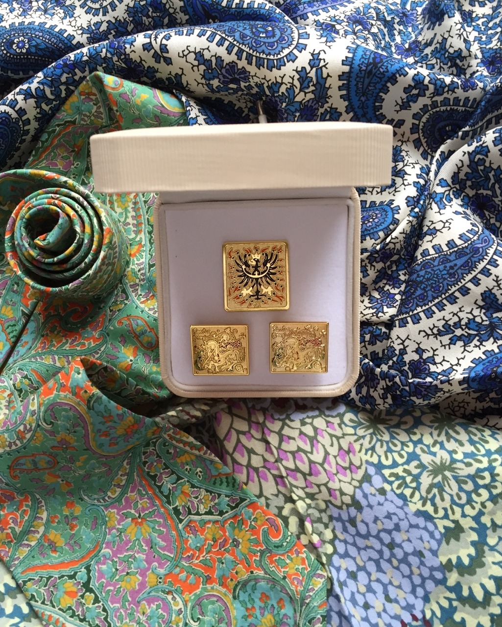 The box of cufflinks with saint George and the dragon + lapel badge of saint Wenceslas (my arts&crafts work)