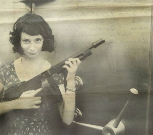 ircimages:
“Madam Moll, gangster from the late 20s, with her M1928 Thompson in front of a bank safe she just robbed
”