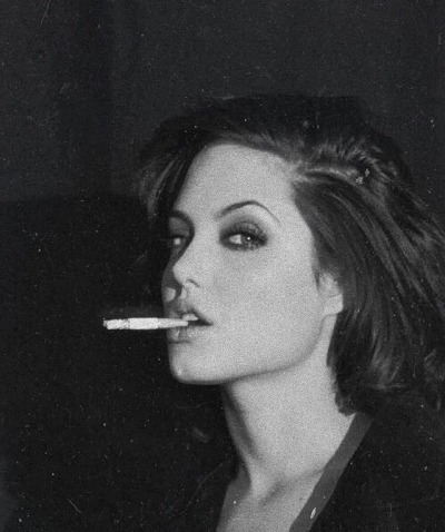 Angelina Jolie smoking a cigarette (or weed)
