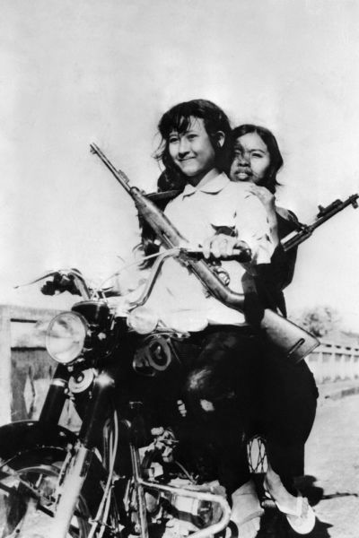 godshufflesherfeet:
“A pair of female Khmer Rouge ride a motorcycle in the streets of Phnom Penh following the city’s fall in April, 1975. The Red Khmer, Khmer Kraham or more commonly used Khmer Rouge were the names given to the followers of the...