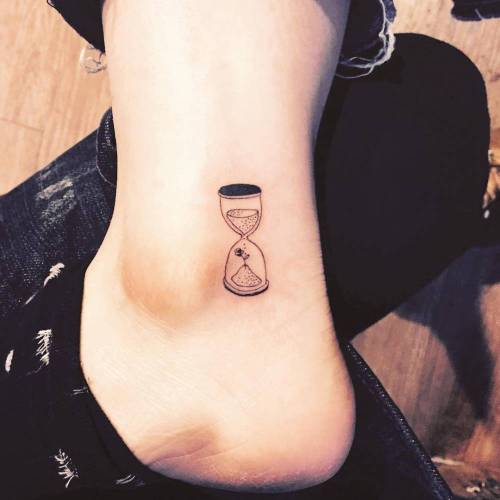 Tattoo tagged with: small, hourglass, micro, black, clock, masa, tiny,  ankle, little, other, illustrative 