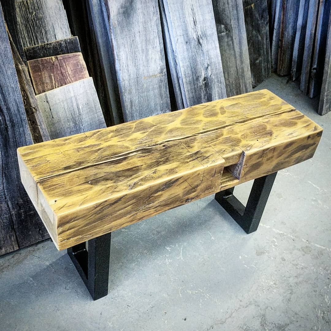 <p>Just completed and available at the Toronto shop - a nice hand hewn bench. This started life as a 100 plus year old hand hewn beam that was cut to size and carefully sanded and clear coated. We mounted it on satin black chunky steel legs.</p>
<p>It is 39 inches long 19 inches tall and 12 inches deep. Perfect for an entranceeay orcat the end of a bed.</p>
<p>One only at $395 plus tax - buy in store or online - click the link in our bio. (at Barnboardstore.com)</p>