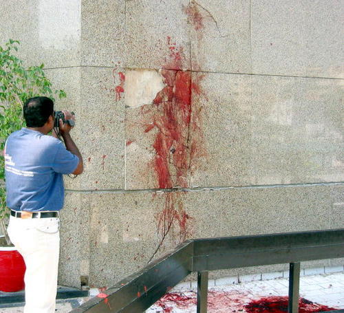 Blood splattered on a wall from a powerful bomb blast which occurred February 3, 2003 in Karachi, Pakistan.