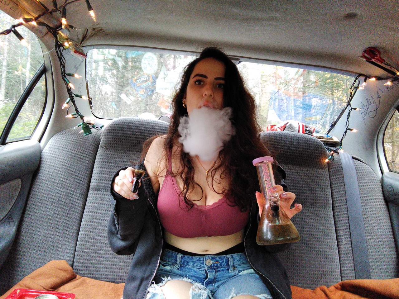 Chubby stoner girl smokes undresses