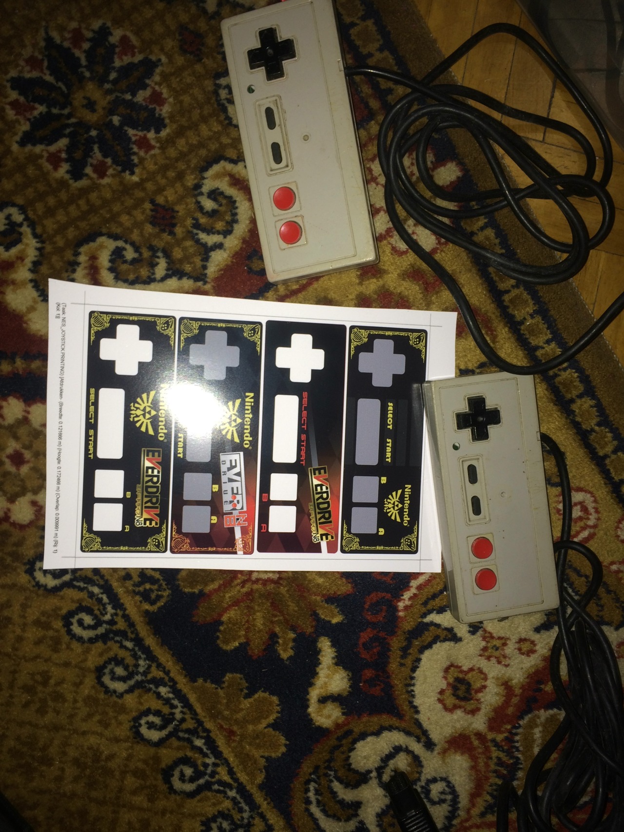 Buy Cheap Nes controllers without stickers, clean them out, and then stick on the new pimp’d stickers :-D