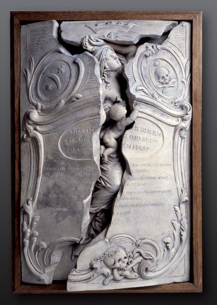 This is a memorial for Maria Magdalena Langhans and her unnamed baby. It was commissioned by Langhans’ husband. Langhan died during childbirth; her baby was a stillborn.