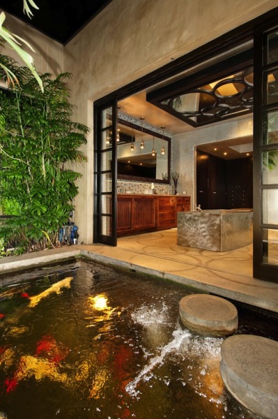 creativehouses:<br /><br />Bathroom opening up to a koi pond