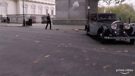 The Bentley from the trailer, driving north up Waterloo Place...