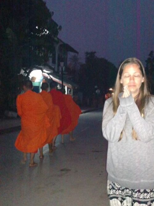 Laos. Monks doing morning alms..