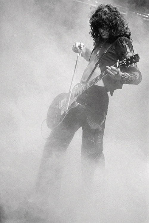 rockandrollpicsandthings:Led Zeppelin, Jimmy Page treating his...