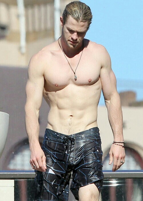 Chris Hemsworth shows off those wet washboard abs and bulge. I...