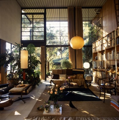 archatlas:<br /><br />Eames House Charles and Ray Eames<br /><br /><br /><br /><br />The Eames House, Case Study House #8, was one of roughly two dozen homes built as part of The Case Study House Program. Begun in the mid-1940s and continuing through the early 1960s, the program was spearheaded by John Entenza, the publisher of Arts and Architecture magazine.In a challenge to the architectural community, the magazine announced that it would be the client for a series of homes designed to express man’s life in the modern world. These homes were to be built and furnished using materials and techniques derived from the experiences of the Second World War. Each home would be for a real or hypothetical client taking into consideration their particular housing needs.<br />The first plan of the Eameses’ home, known as the Bridge House, was designed in 1945 by Charles Eames and Eero Saarinen. The design used pre-fabricated materials ordered from catalogues, a continuation of the idea of mass-production. Charles and Ray moved into the House on Christmas Eve, 1949, and lived there for the rest of their lives.  The interior, its objects and its collections remain very much the way they were in Charles and Ray’s lifetimes.  The house they created offered them a space where work, play, life, and nature co-existed. <br />Images via + via + via<br />