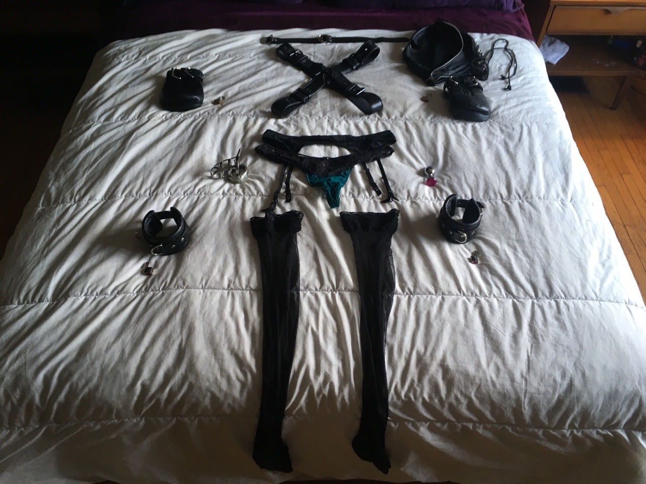 bondage gear spread on the bed
