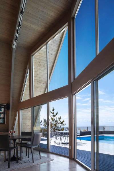 cjwho:<br /><br />A-Frame Residence, New York, USA by Bromley Caldari Architects | via<br />This striking looking A-Frame Residence is the result of an architecture conversion delivered by New York City-based studio Bromley Caldari Architects. The designers completely renovated the interiors of a 1960s beach home on Fire Island, turning it into a sleek hideout. With a spiral staircase splitting down the middle, four dark and cramped bedrooms, a leaky roof, and a cracked pile foundation, the original building required serious interventions.<br />By adding a new staircase, the layout was positively transformed and functionality took over he entire abode: “On the main level, a double-height living/dining room stretches the length of the window-clad north façade. The open kitchen and house utilities run along the south side. The master bedroom suite features full-height glass sliding doors that take advantage of the view. Although the doors stay mostly open, when guests are present and privacy is required, the sliding glass doors fog up at the flick of a switch.”<br />CJWHO:  facebook  |  instagram | twitter  |  pinterest  |  subscribe<br />