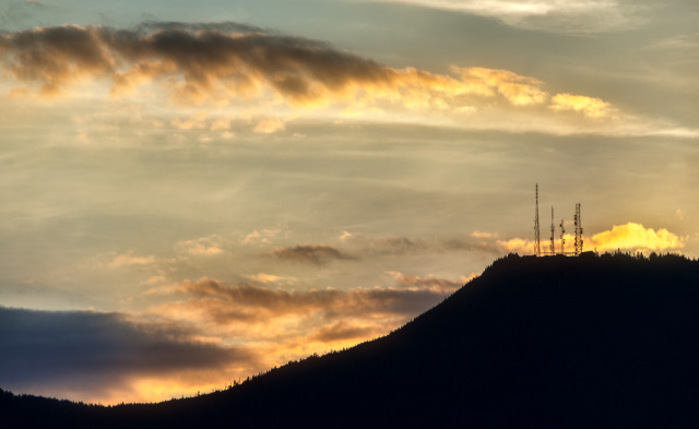 Fiery sunset over some distant radio towers. I love the silhouette that backlit mountains can make.