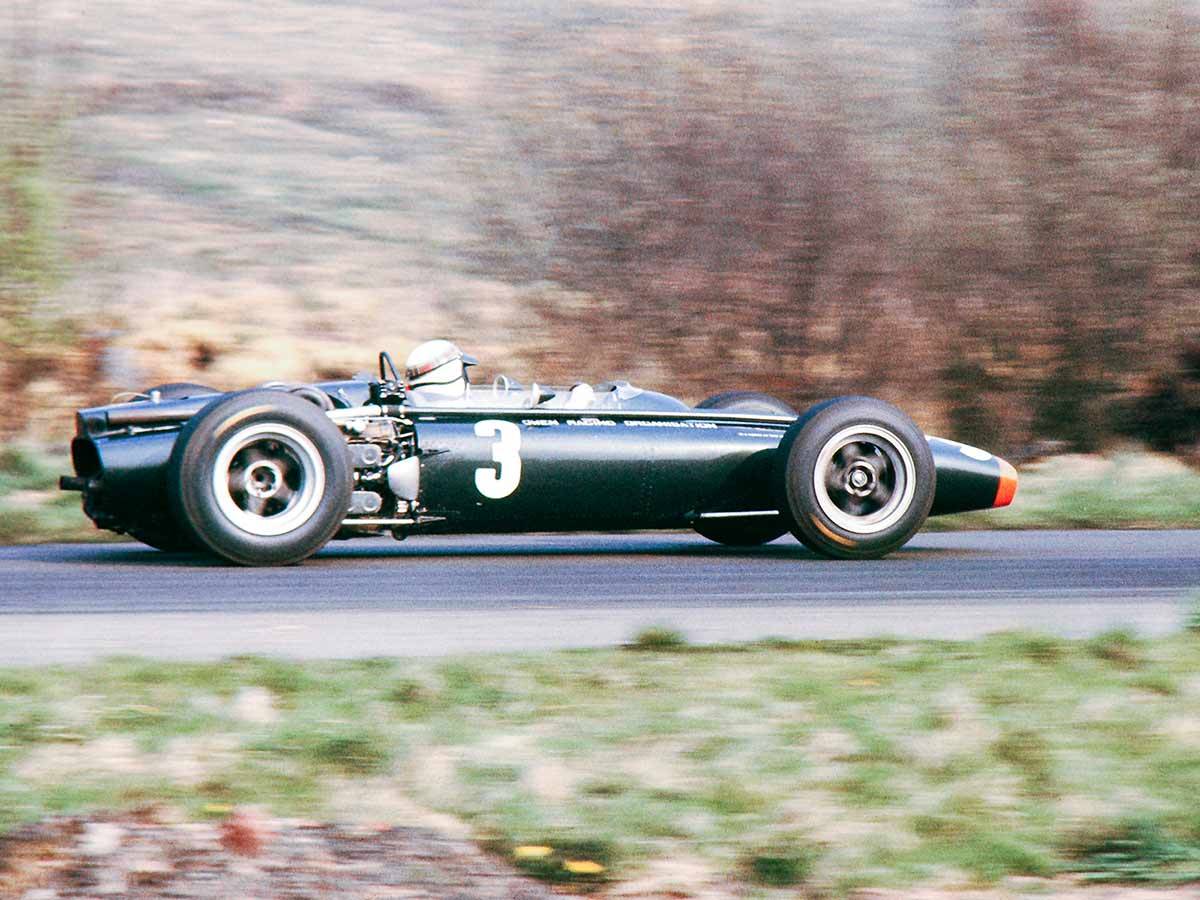 A side shot of Jackie Stewart and his BRM P83... - Legends of Racing