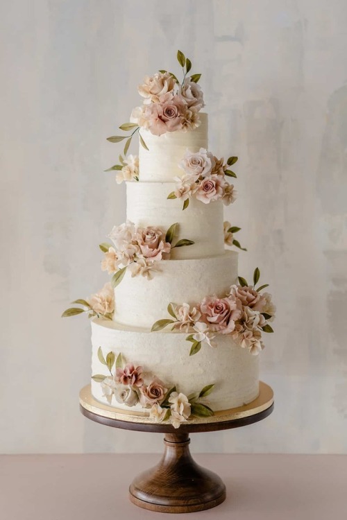 Beautiful 4 tier wedding cake with floral appliques by Winifred...