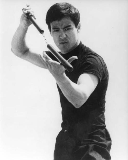 gutsanduppercuts:A young Bruce Lee practicing on the beach...