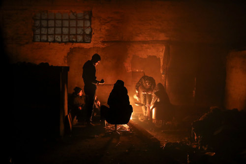 yahoonewsphotos:Trapped in Serbia, migrants shelter in a...