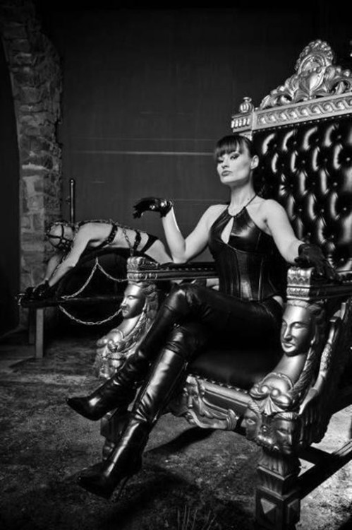 I love it. Her slave bound and chained in the background for her...