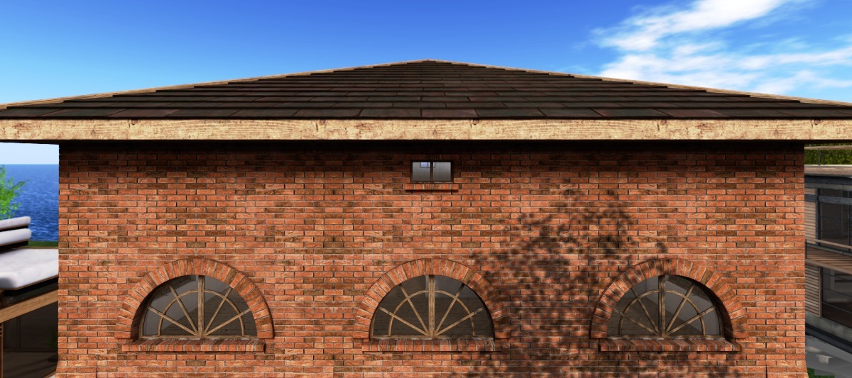 Hipped roof, terracotta cladding and round-arched windows
