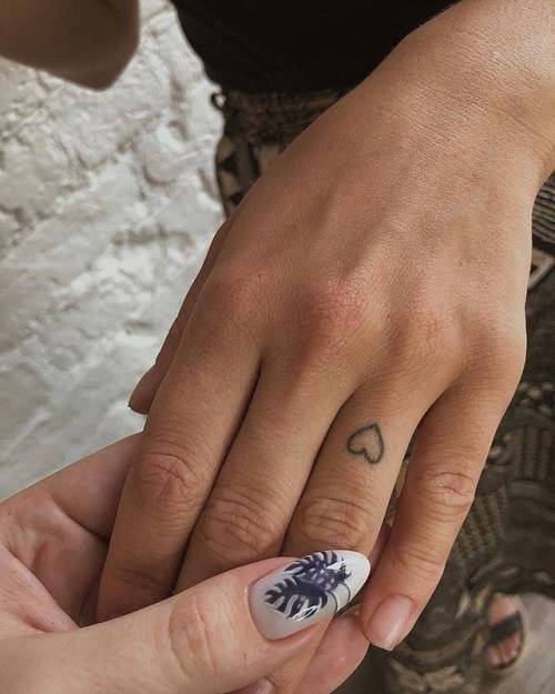 Healed rose on the right ring finger