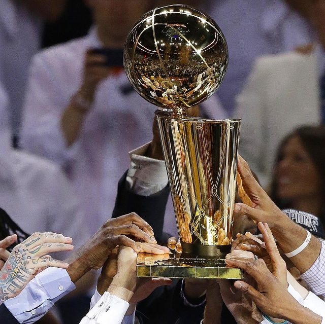 Sporting News: CHAMPIONS In the first image, Miami Heat...