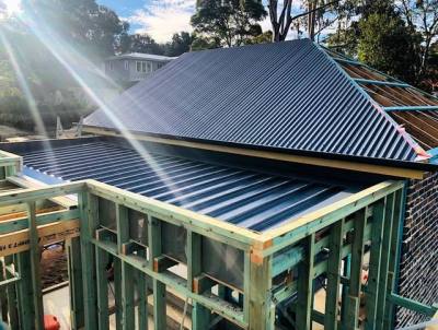A gorgeous day spent putting a lid on our new garage and breezeway connection at our Hunters Hill build