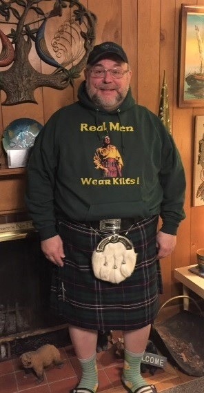 teddy bear wearing a kilt