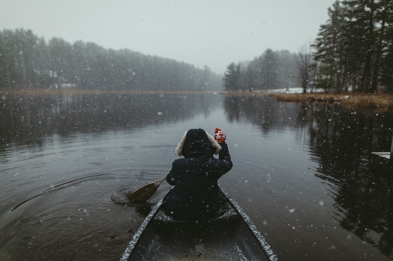 snowy lake canoe
