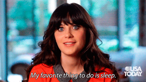 Brunette with bangs and bright blue eyes says, My favorite thing to do is sleep. (Zoey Deschanel)