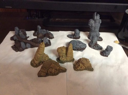 A dozen terrain elements I painted over the weekend. These are...