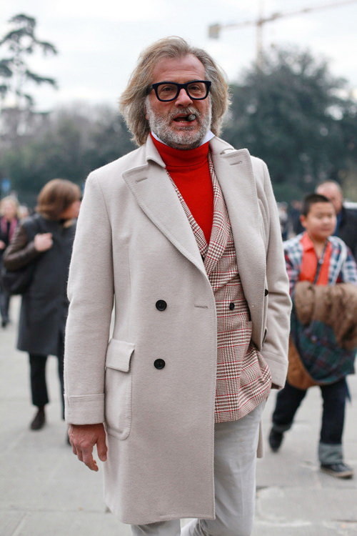 Off white overcoat with plaid sportscoat & red turtleneck sweater