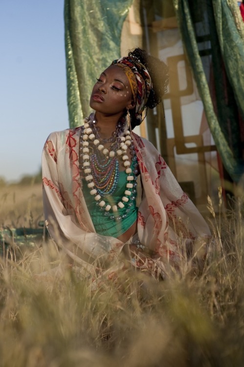 african inspired fashion editorial layered necklace beadwork african wax print head scarfs folkloric africa contemporary fashion feather adornment