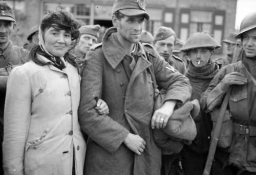 loveinthetimeofwarww2:A Dutch woman is seen here with her...