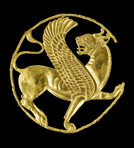 dwellerinthelibrary:“This snarling winged lion worked in gold...