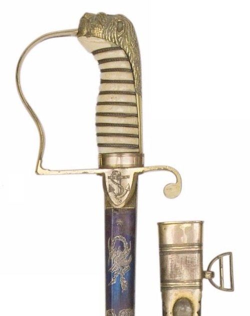 British Pattern 1805 Naval Officer’s Sword By Shrapnall, 61 Charing Cross, Early 19th Century. The blade etched and gilt...