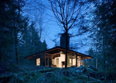 archatlas:<br /><br /><br /><br />Tye River Cabin Olson KundigSituated in a dense forest near the Tye River, this meditative retreat connects to the nature that surrounds it.The square base of the two-level structure is rendered in cast-in-place concrete, as is the large central fireplace that serves as the core and anchor for the cabin. Custom-designed, pivoting glass windows swing open to reveal the corners and sides of the space, blurring the line between inside and outside. Rusted mild steel siding wraps the exterior areas not given over to windows. Deep overhangs shelter the main living area from the regular rain showers. Concrete patios extend the living space outdoors and follow the contours of the land toward the water.Images and text via<br /><br /> Olson Kundig<br /><br />