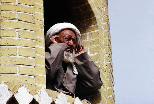 julaibib:China, Kashgar, Muezzin at call to prayer from minaret...