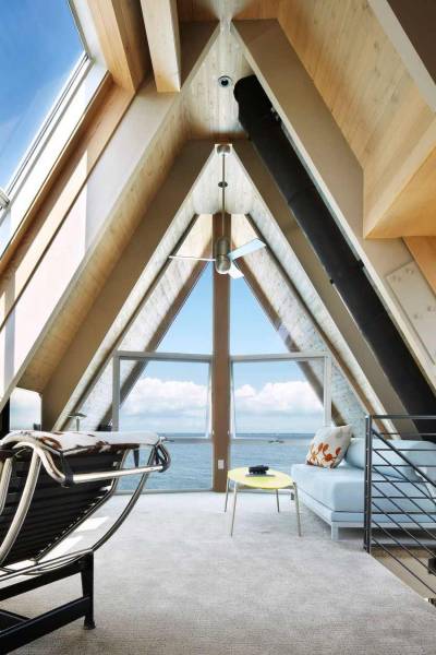 cjwho:<br /><br />A-Frame Residence, New York, USA by Bromley Caldari Architects | via<br />This striking looking A-Frame Residence is the result of an architecture conversion delivered by New York City-based studio Bromley Caldari Architects. The designers completely renovated the interiors of a 1960s beach home on Fire Island, turning it into a sleek hideout. With a spiral staircase splitting down the middle, four dark and cramped bedrooms, a leaky roof, and a cracked pile foundation, the original building required serious interventions.<br />By adding a new staircase, the layout was positively transformed and functionality took over he entire abode: “On the main level, a double-height living/dining room stretches the length of the window-clad north façade. The open kitchen and house utilities run along the south side. The master bedroom suite features full-height glass sliding doors that take advantage of the view. Although the doors stay mostly open, when guests are present and privacy is required, the sliding glass doors fog up at the flick of a switch.”<br />CJWHO:  facebook  |  instagram | twitter  |  pinterest  |  subscribe<br />