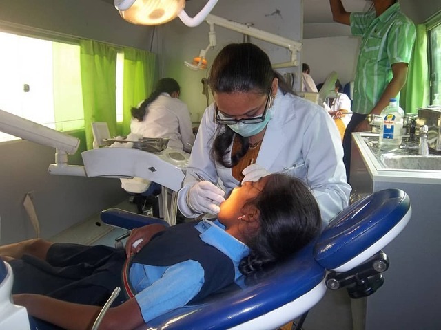 Trinity Care Foundation — Dental treatment on mobile dental unit as part of...