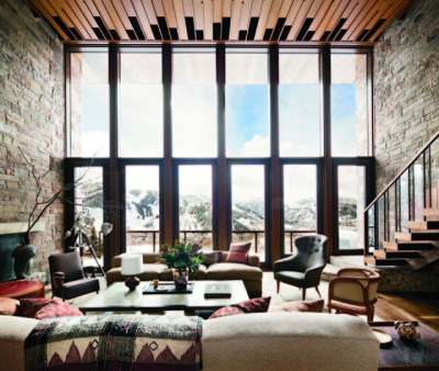 Stone walls flank mahogany ceiling and windows with views of the mountains in Aspen, Colorado. [OS][1200x1015]